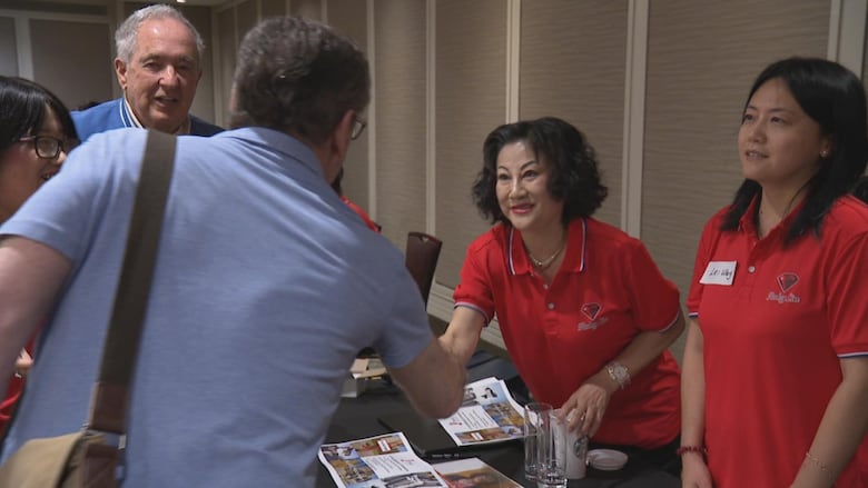 woman shaking a guy's hand