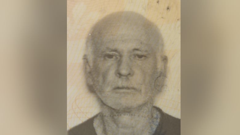 Elderly man wearing dark shirt