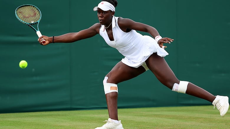Canadian women’s tennis player Victoria Mboko plays a forehand against Magdalena Frech of Poland during a women’s first-round match at Wimbledon on July 1, 2025 in London, England. 