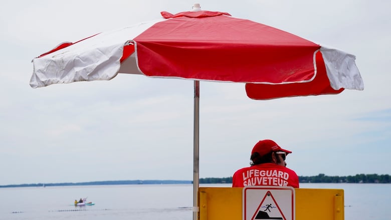 A lifeguard working at Britannia Beach in Ottawa on June 24, 2022. The Lifesaving Society says only one per cent of drowning deaths in Ontario last year happened in lifeguard-supervised settings.