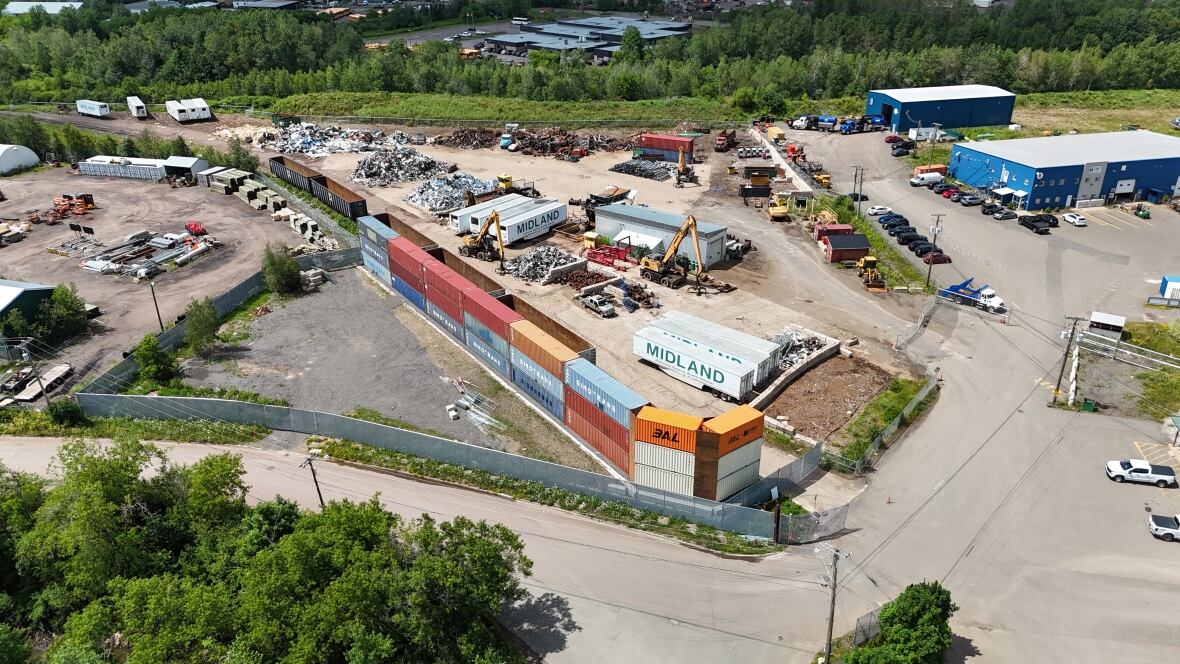 Aerial shot of a metal scrapyard in the summer