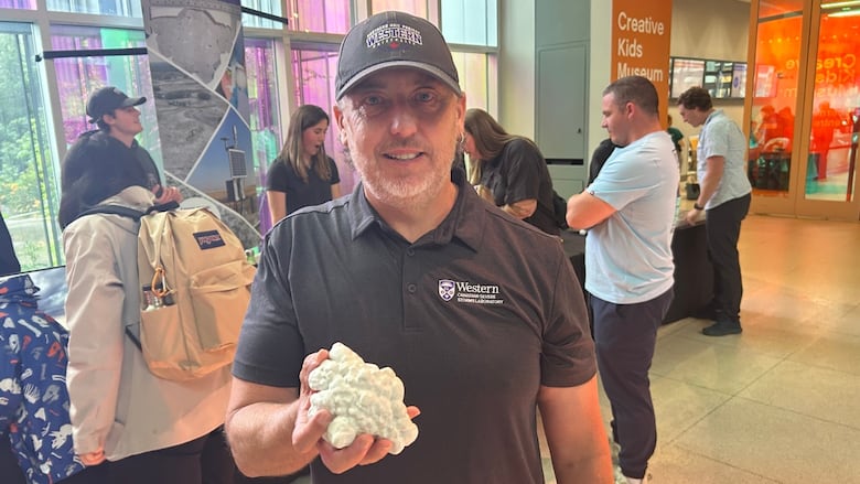 Julian Brimelow, executive director of the Northern Hail Project, displays a 3D replica of a near record hailstone collected in 2022.