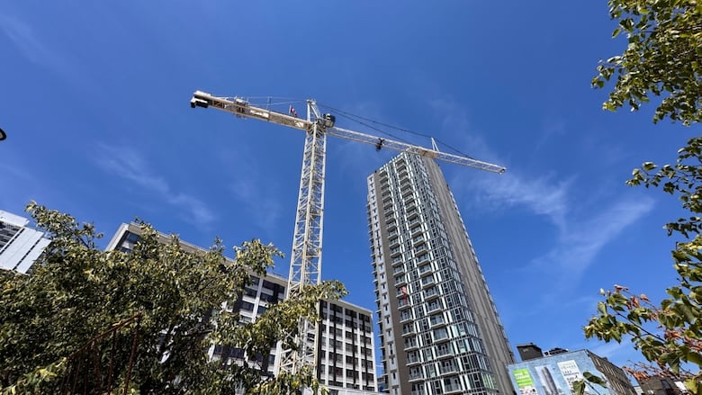 A crane towers over a development along King Street in downtown London, Ont.