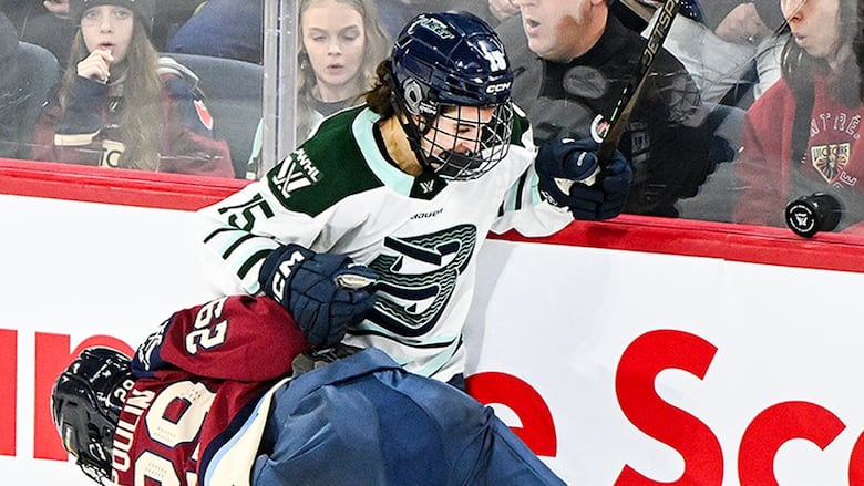 Montreal Victoire's Marie-Philip Poulin collides with Boston Fleet's Sydney Bard during third period PWHL regular-season action in Laval, Quebec on December 30, 2024. 