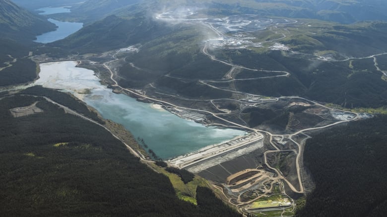 An aerial photo of a mine and tailings pond.