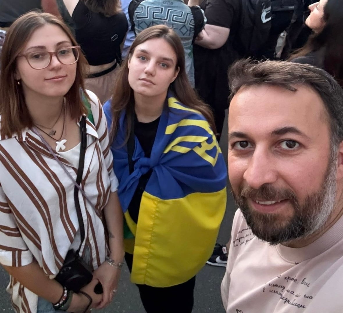 Azad Safarov (right) stands beside two other protesters in Kyiv on Wednesday July 23. 