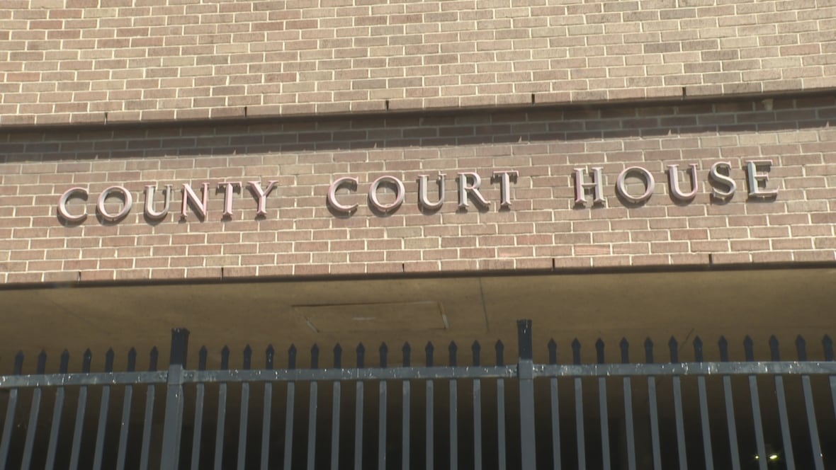A sign at a courthouse.