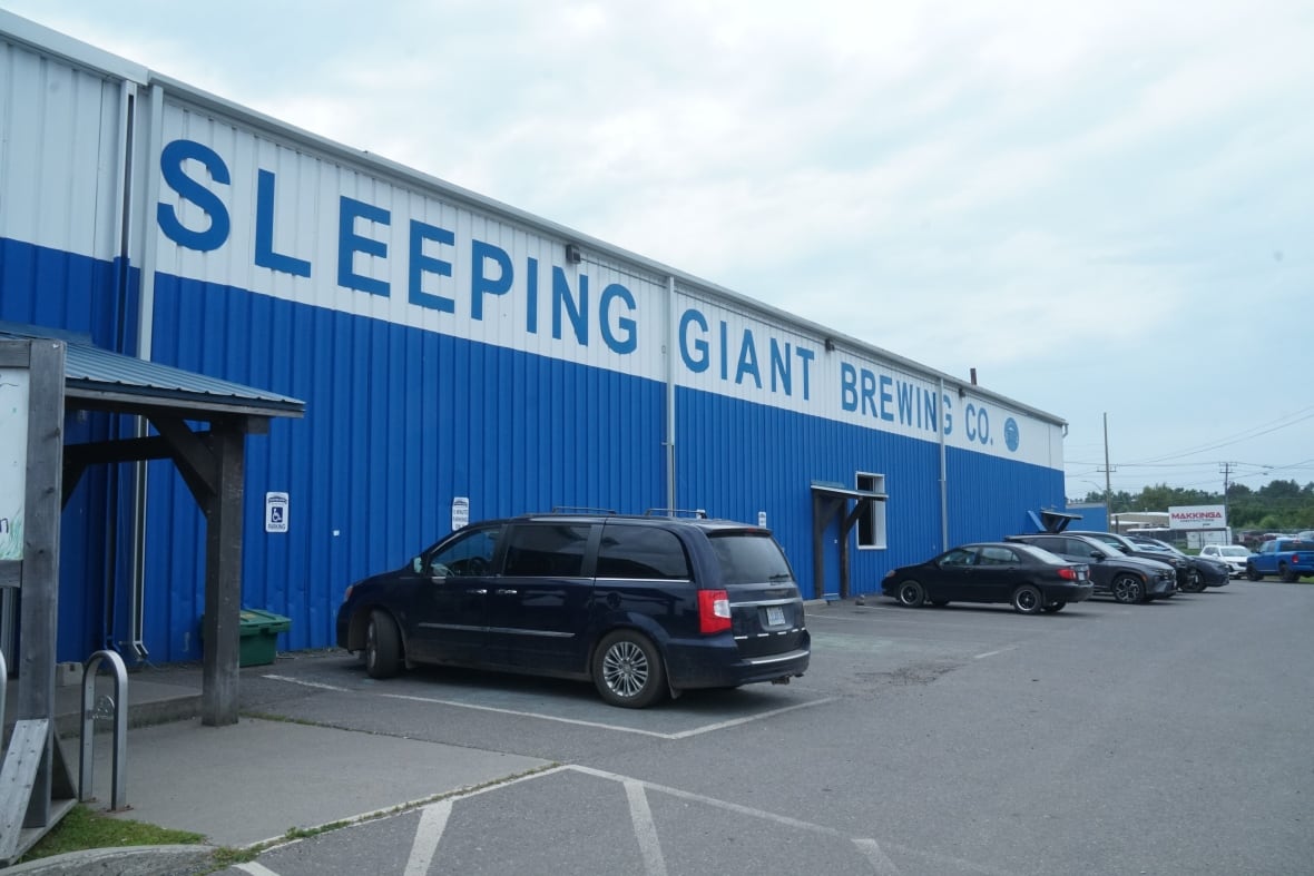 Sleeping Giant Brewery in Thunder Bay has cars parked outside. 