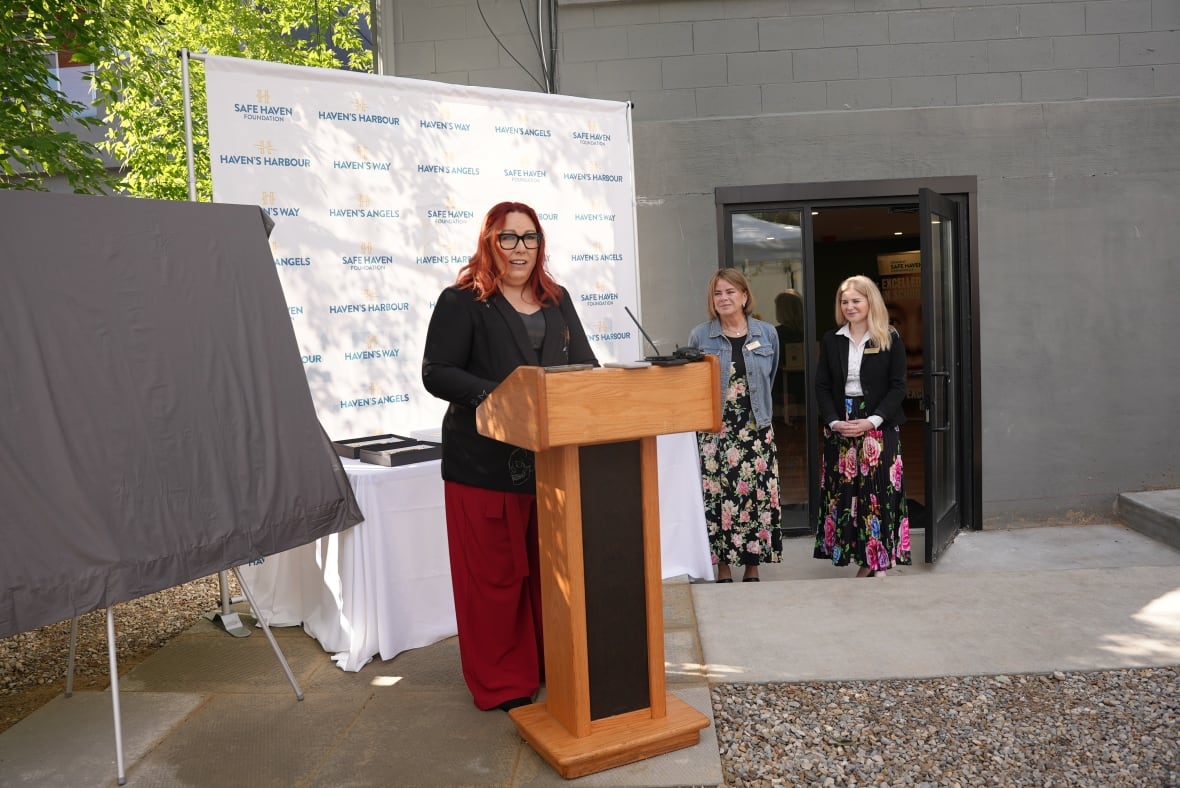 Melissa Wheeler speaking at a podium.