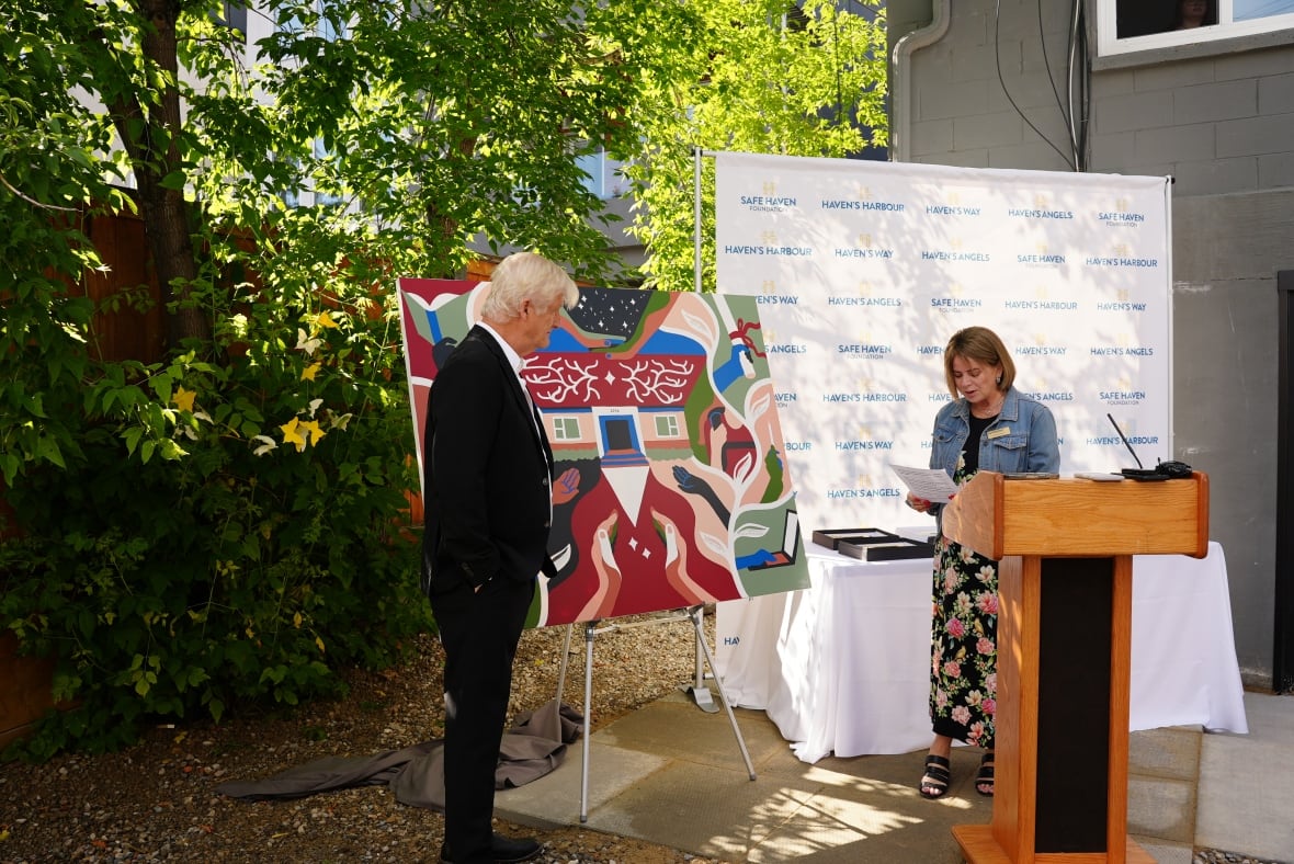 Karen and John Sherbut speaking at an announcement.