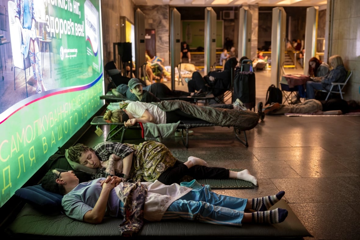 People take shelter in a metro station during a Russian drone and missile attack, amid Russia's attack on Ukraine, in Kyiv, Ukraine July 21, 2025.