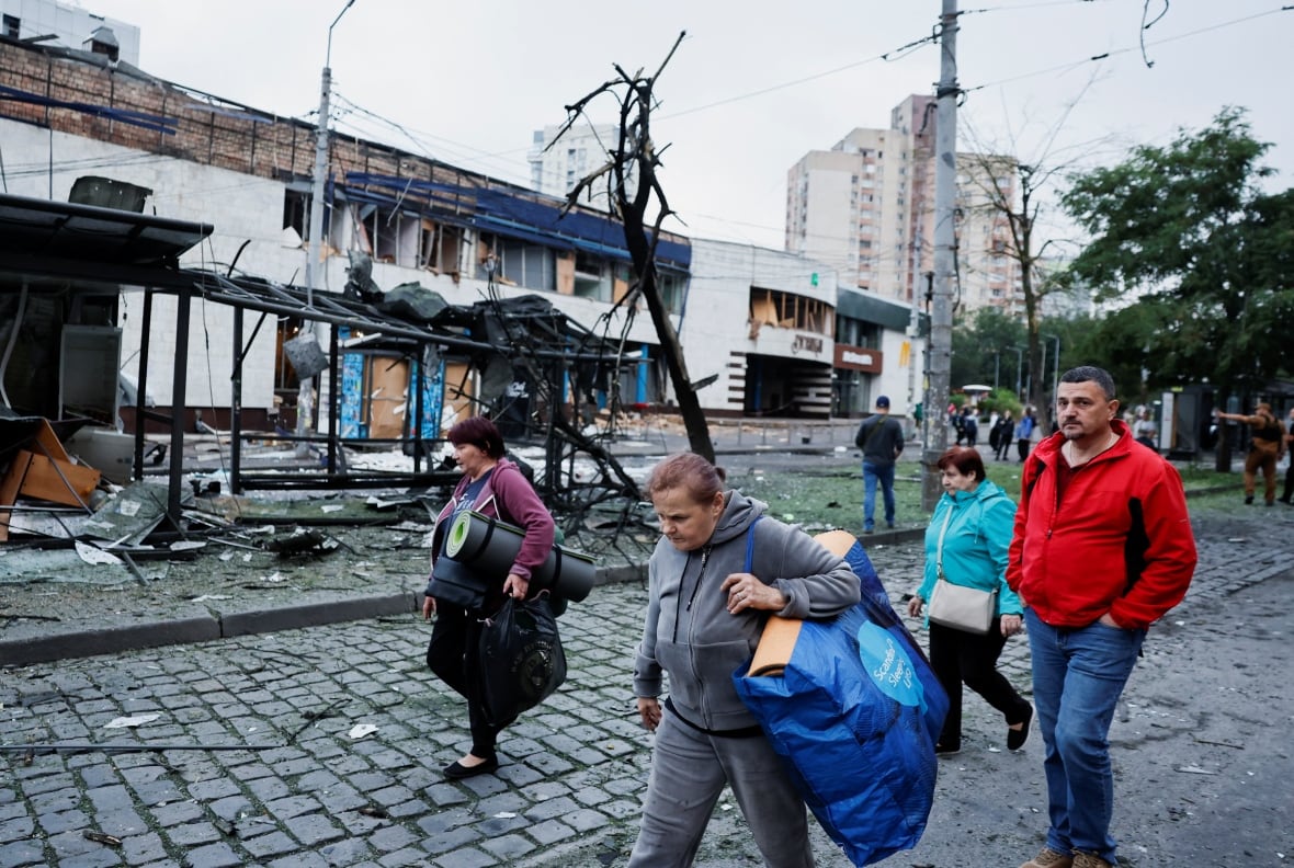 People who sheltered in a metro station during the night of Russian drone and missile strikes, leave the damaged metro station, amid Russia's attack on Ukraine, in Kyiv, Ukraine July 21, 2025.