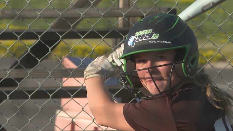 Chloe Moore of the Team P.E.I. women's softball team gets ready for a pitch from her coach.