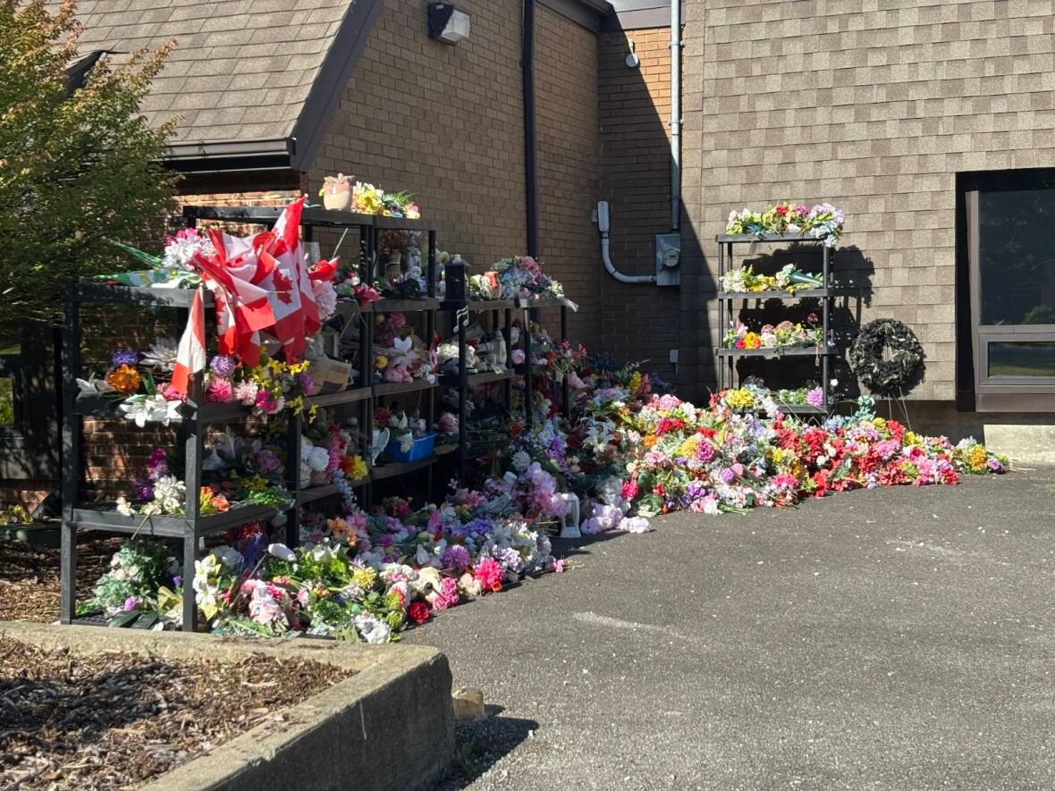 Some of the silk flowers and trinkets removed from graves at Heavenly Rest cemetery in LaSalle.