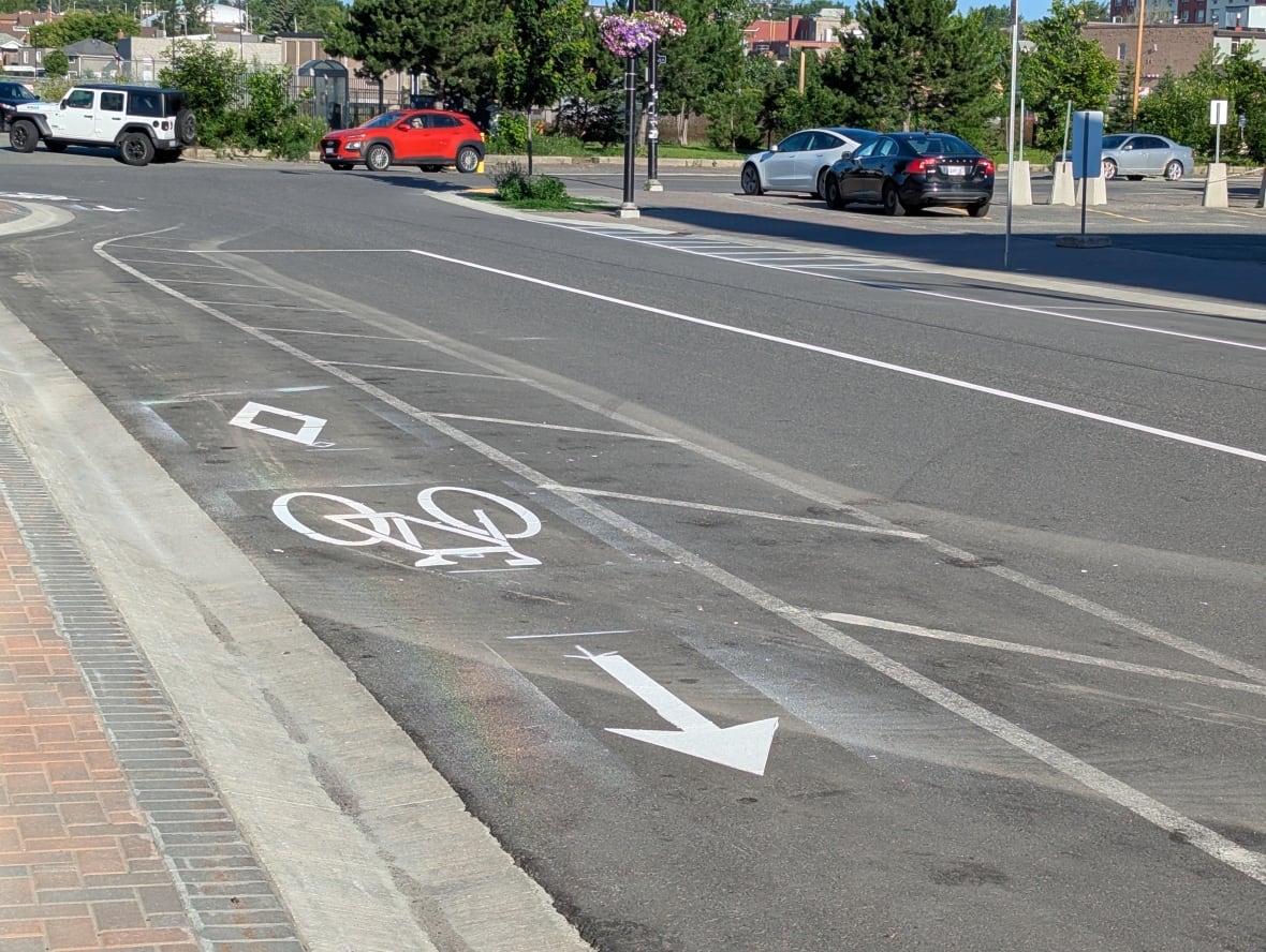 A painted bike lane on a street.