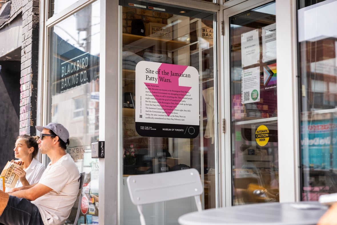 Poster installed near historic site of Jamaican Patty Wars in Toronto.