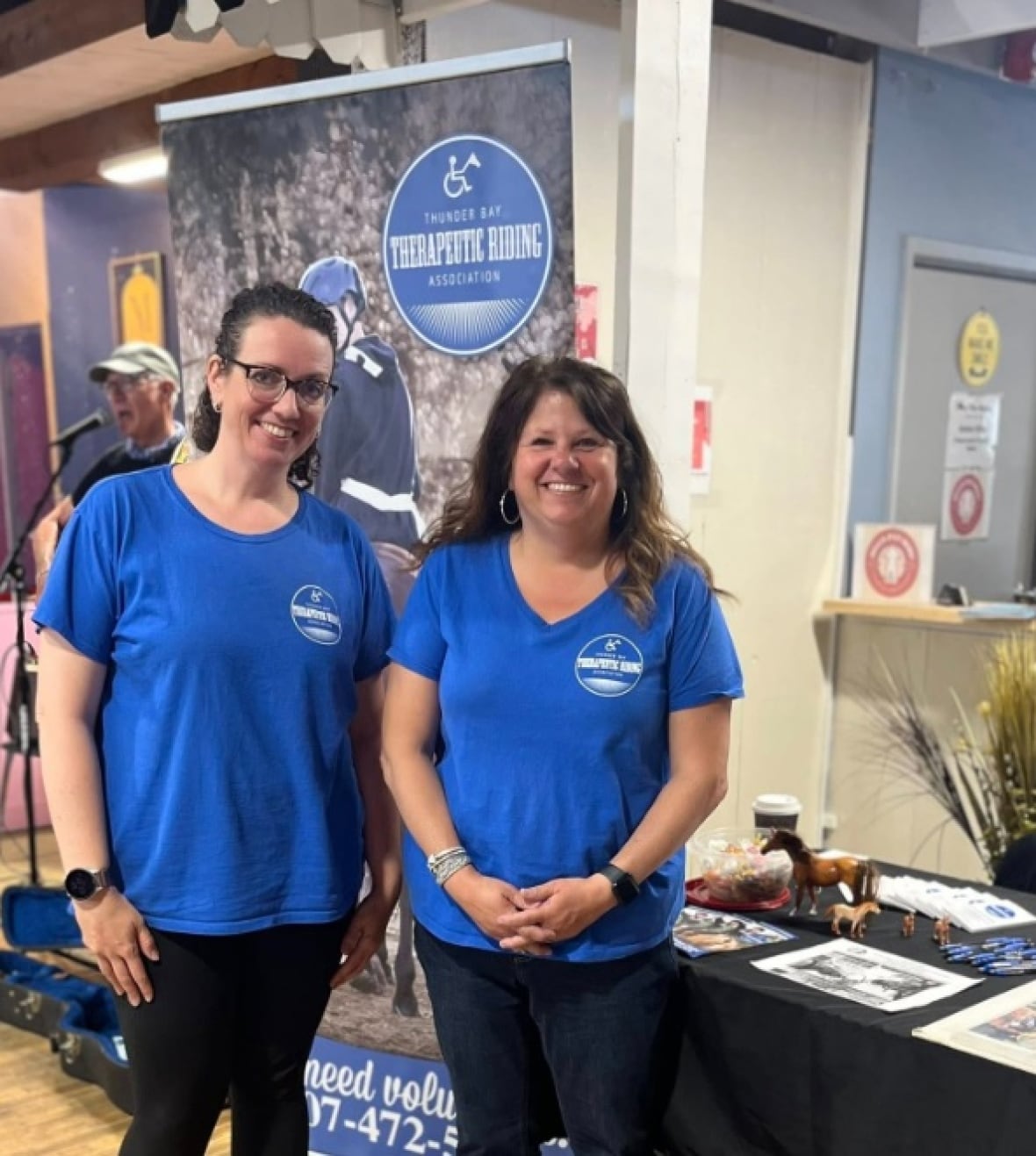 Two people involved with the Thunder Bay Therapeutic Riding Association spread the word about programming and volunteer opportunities at the Thunder Bay Country Market.