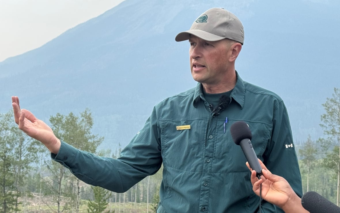 A resource conservation employee for the Jasper National Park, shows the latest cleared section of forest north of the Jasper townsite.