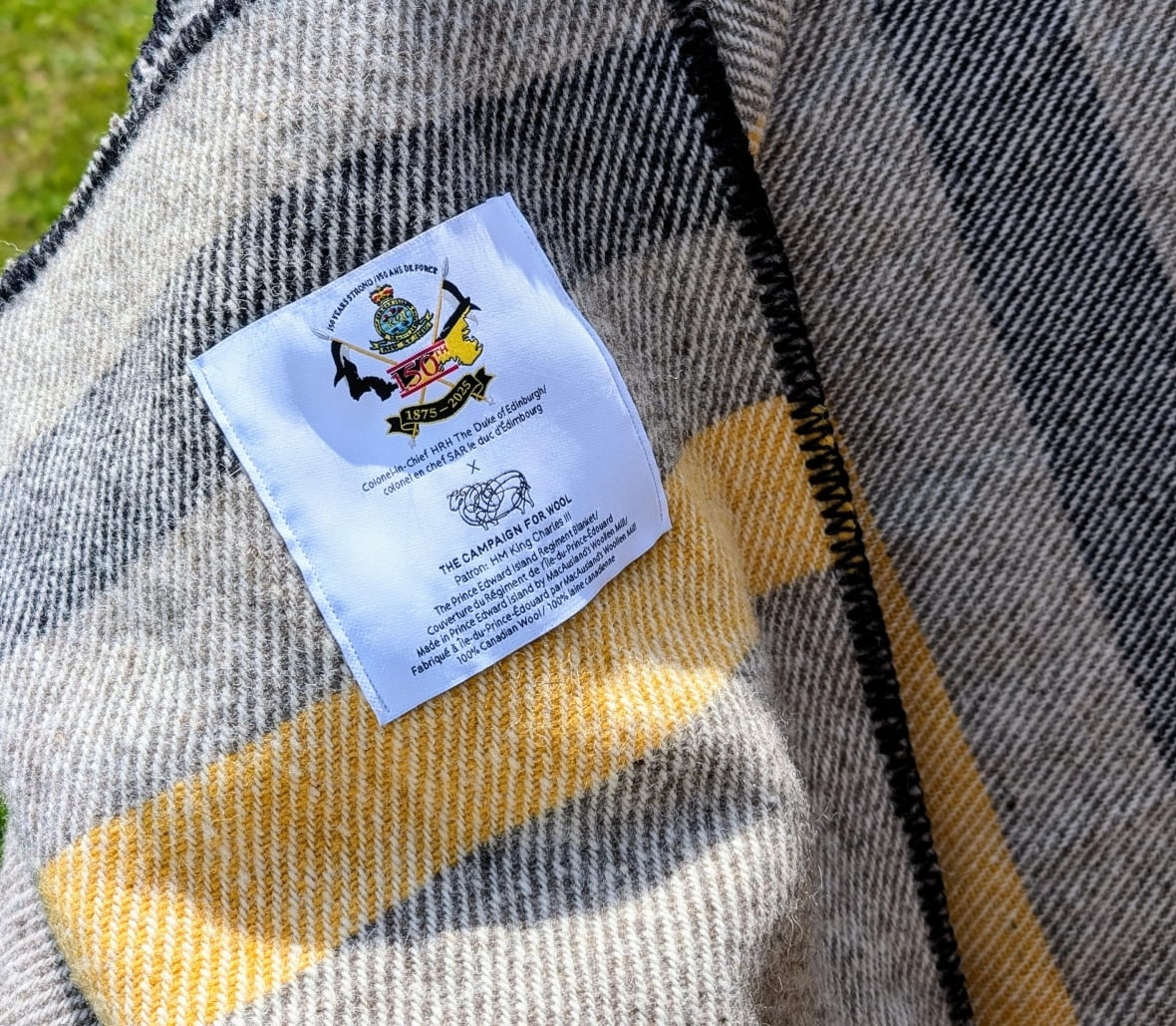 A commemorative label on a blanket.