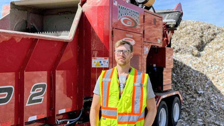 David Watling, Yellowknife’s waste management planner, in front of the giant shredder at Yellowknife's Solid Waste Facility.