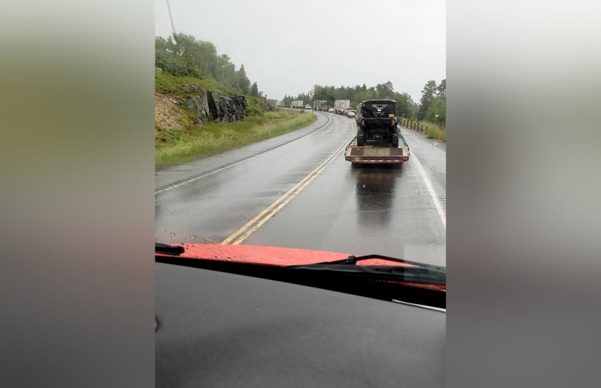A group of cars line on the highway.