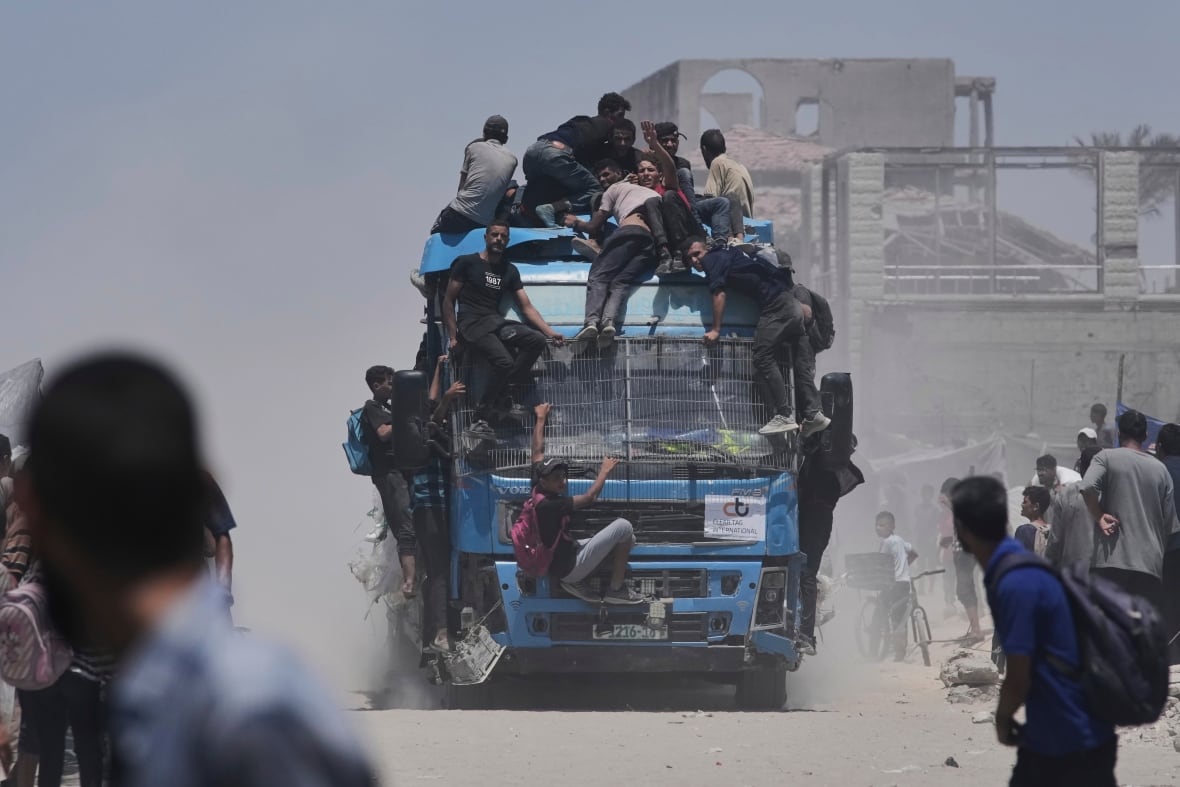 People live atop or stick to a moving truck.