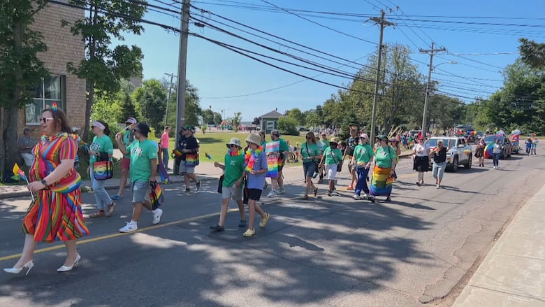 A large group of people walking down the street.