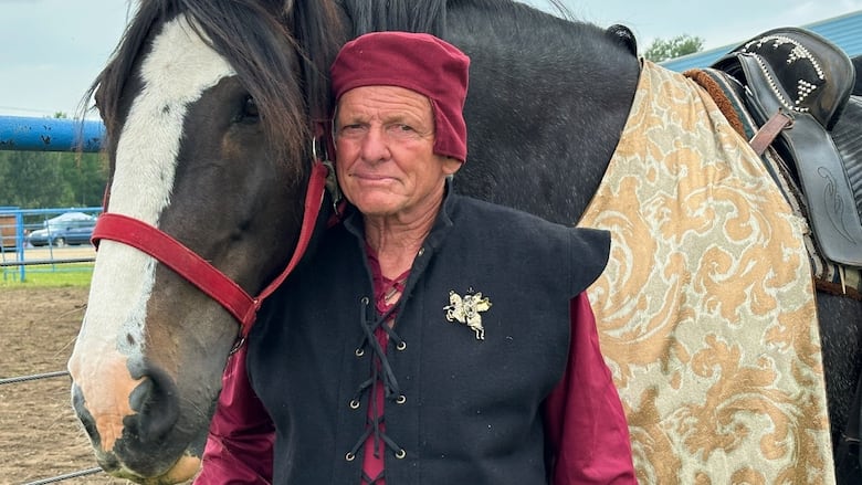 A man and a horse.