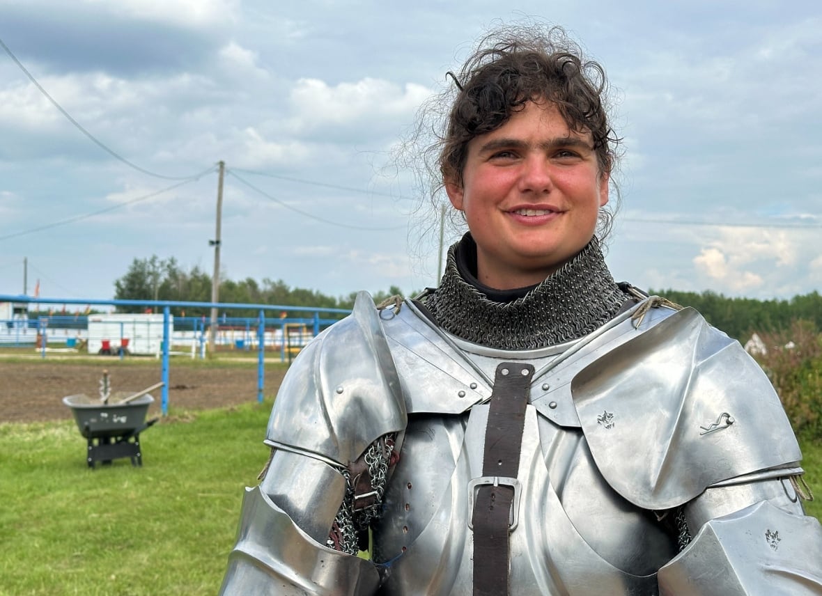 A woman in a suit of armour.