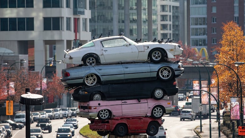 Pigeons perch atop the Trans Am Totem, now known as the Trans Am Rapture in Vancouver, British Columbia on November 1, 2019.