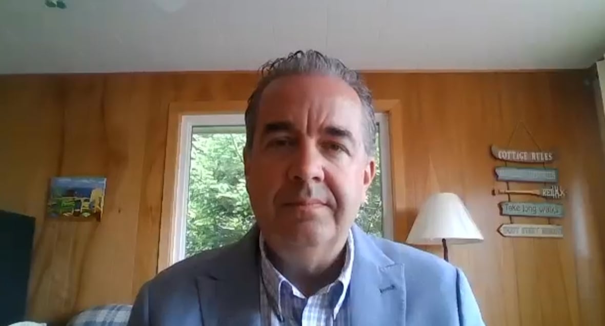 Man in suit on Zoom call