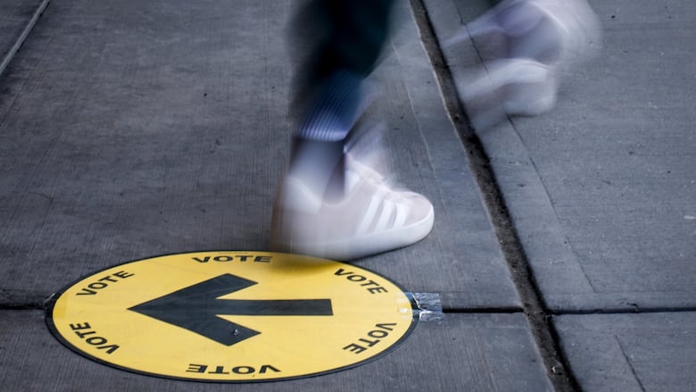A voter leaves a polling station after casting a ballots in the federal election in Calgary, Monday, April 28, 2025.