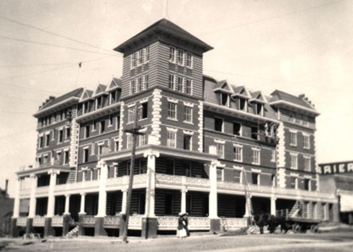 A black and white photo of a large building.