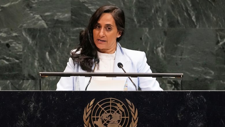 A woman speaks at a podium.