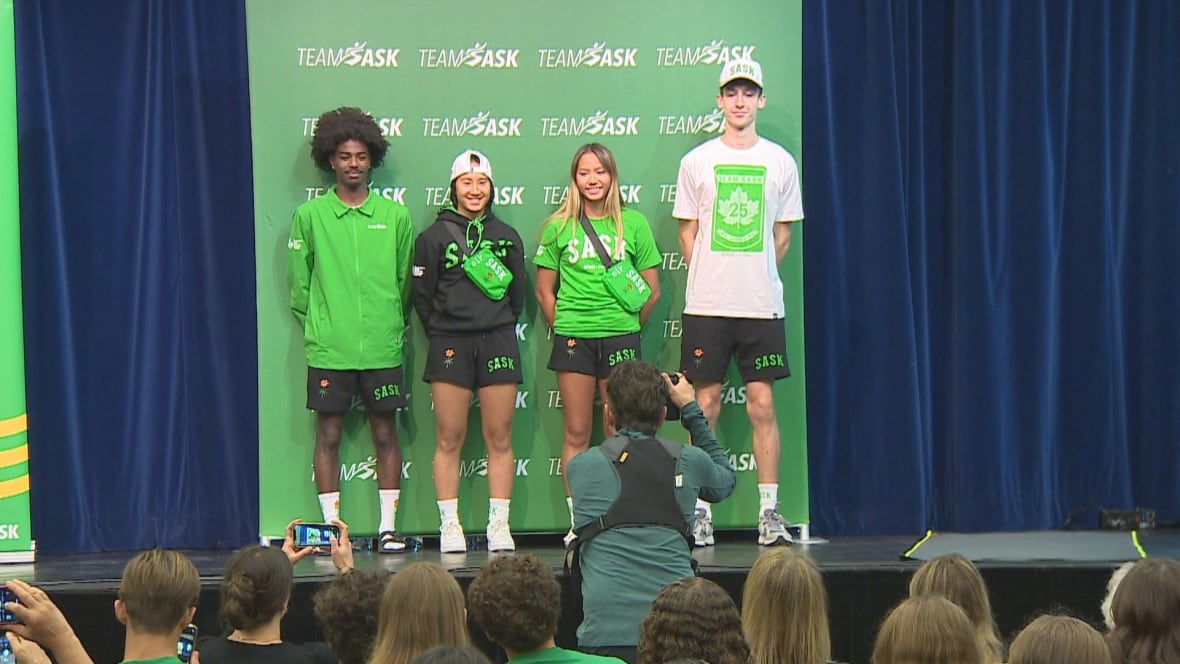 four teens wear new team sask merch.