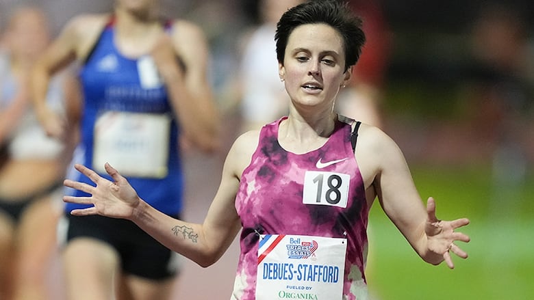 Canadian distance runner Gabriela DeBues-Stafford crosses the finish line to win the women’s 5,000 metres at the Canadian Track and Field Olympic trials in Montreal on June 27, 2024. 