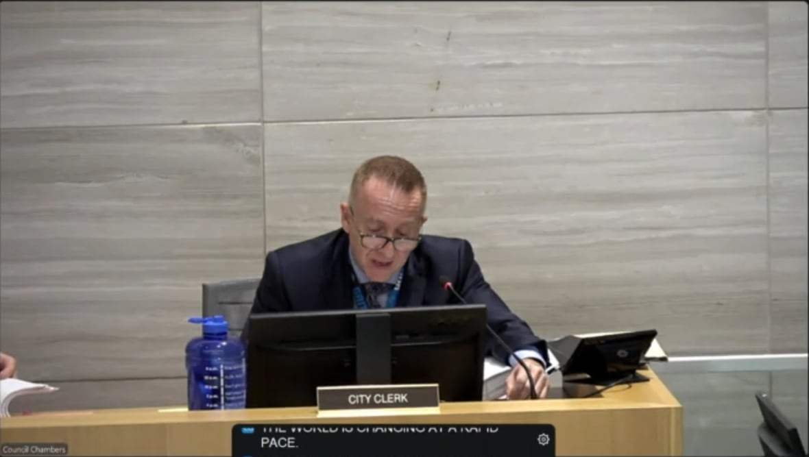 Vlachodimos at his desk in the council chambers.