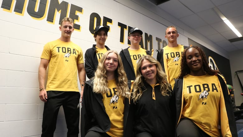 people in team manitoba gear. 