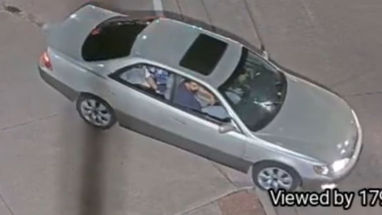 3 men occupy a Lexus car.