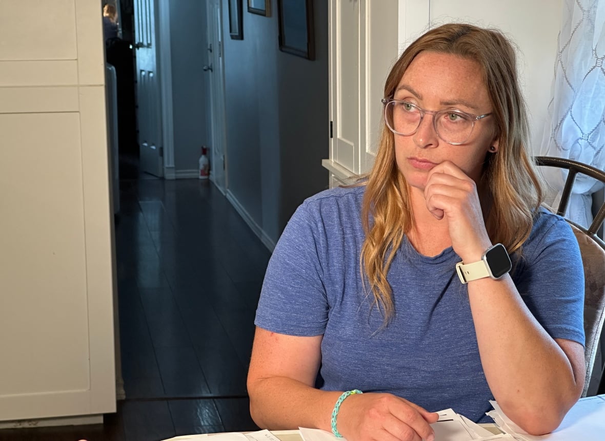 A woman sitting at a table.