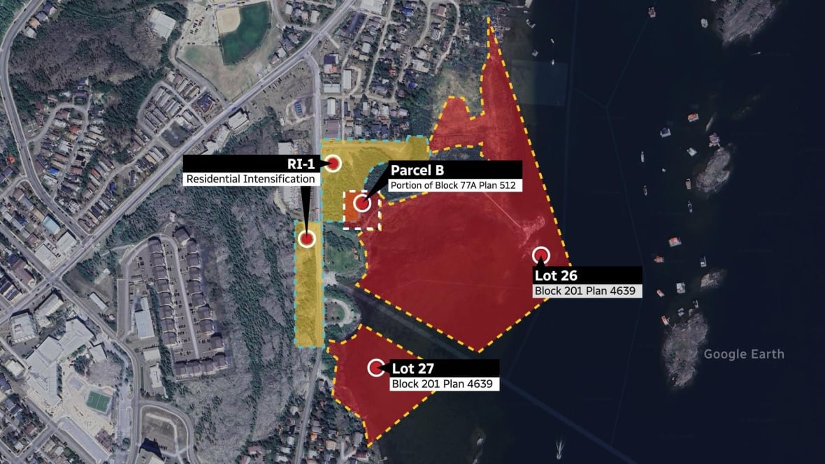 A satellite view of Yellowknife with areas highlight in red and yellow, with some overlap.