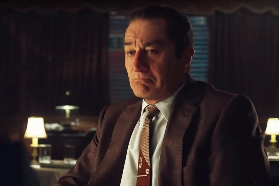 An actor wearing a suit.