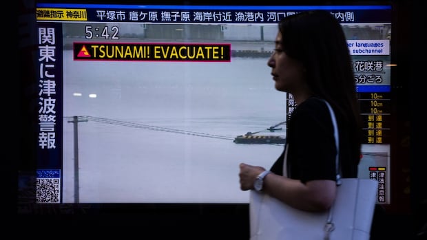 Japan, Hawaii and Russia downgrade tsunami warnings after powerful earthquake
