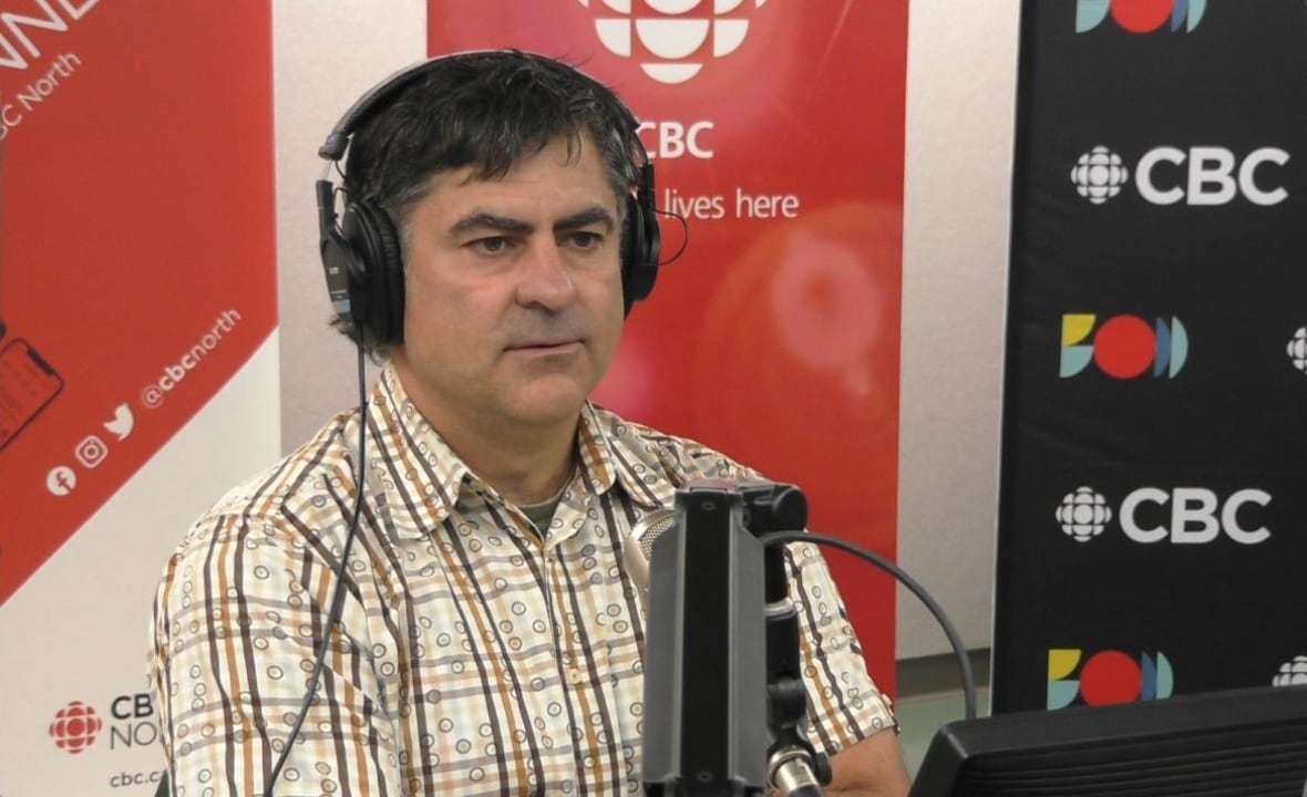 A man with headphones on.