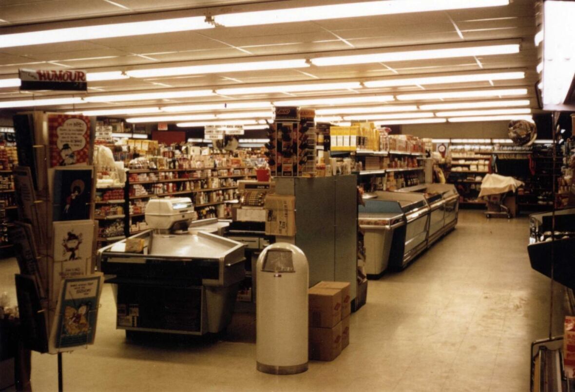 A store with produce and goods visible.