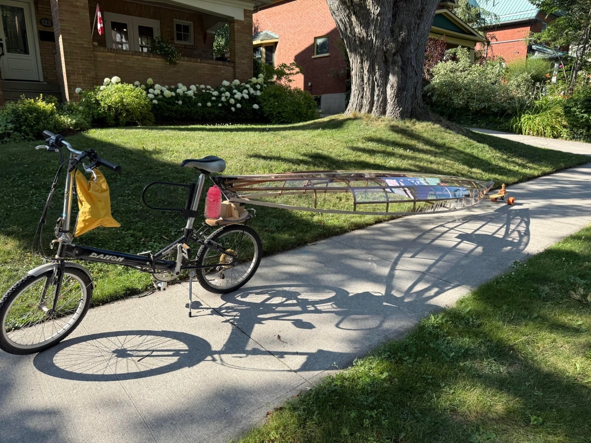 Photo of a bike hitched to a canoe