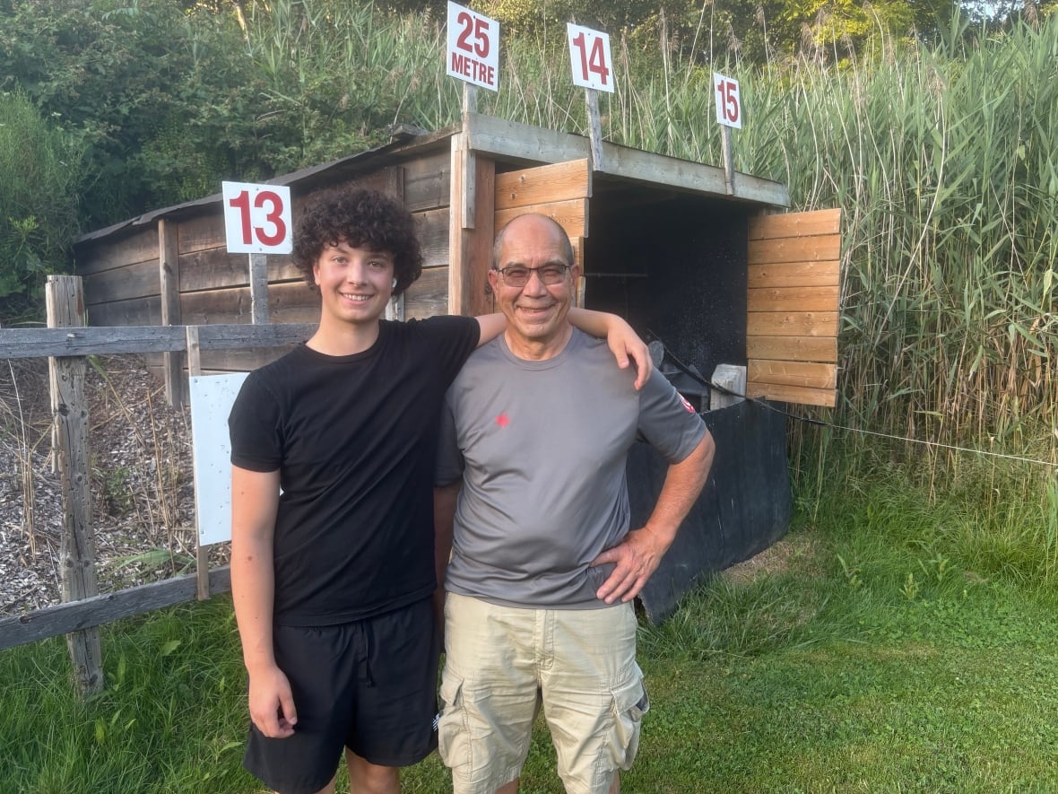 Lucas and Glynn Loftin standing together at shooting range.