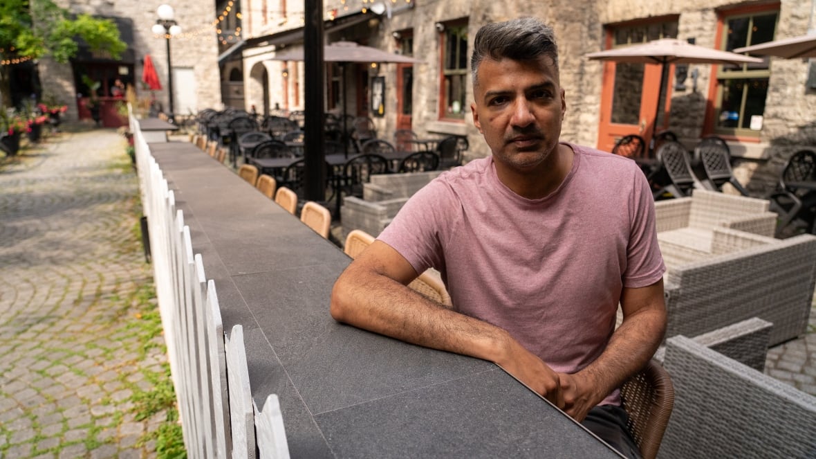 Vish Tyagi, general manager of Beyond the Pale Brewing Company, sits screen right facing the camera.