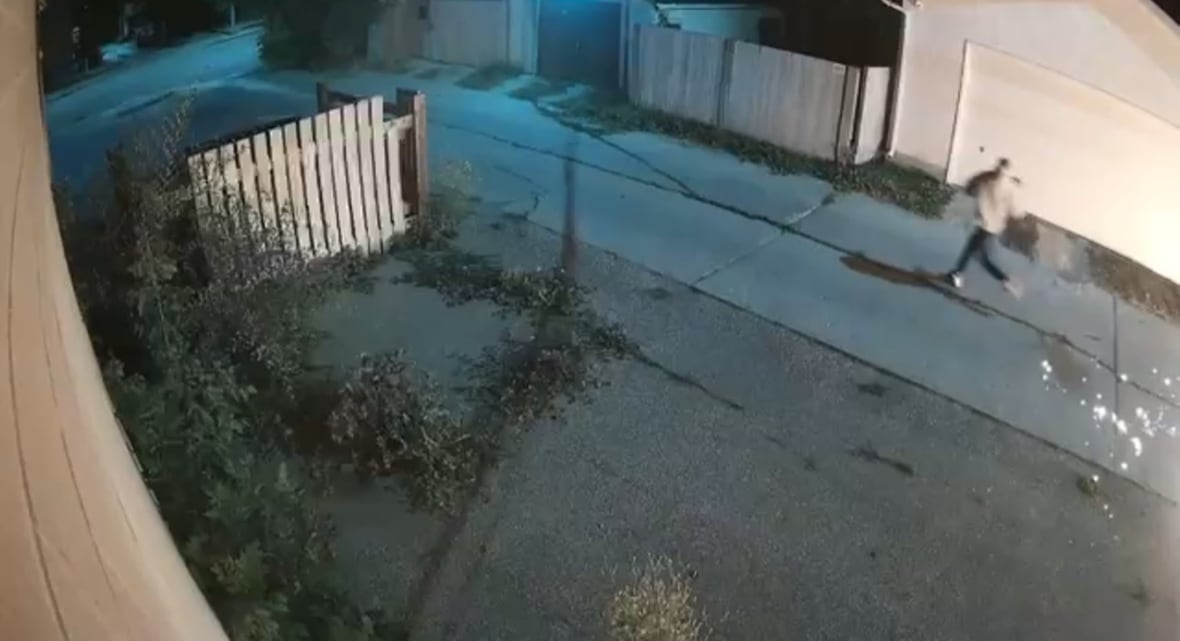 A man runs from a spark