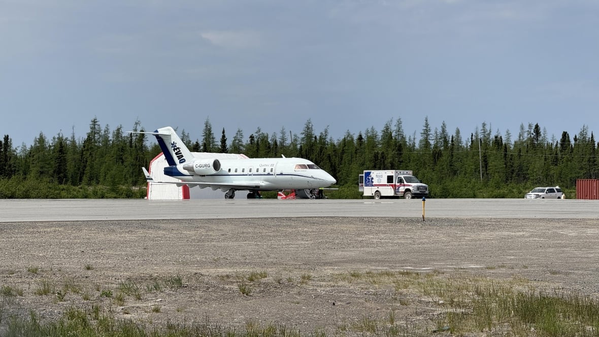 A plane with the letters EVAQ on the tail.